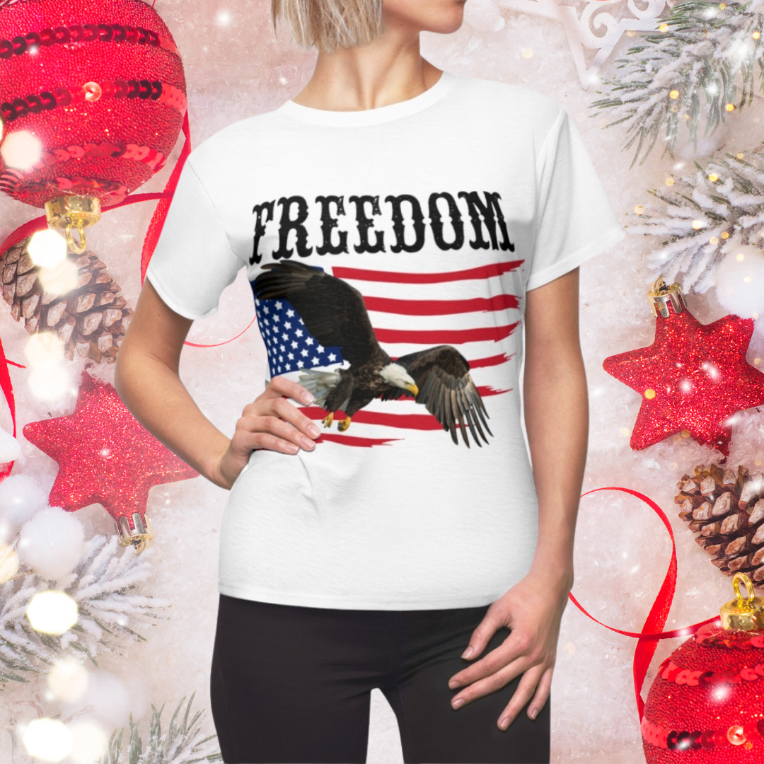 Person wearing a white t-shirt with an eagle and 'FREEDOM' graphic, surrounded by Christmas decorations.