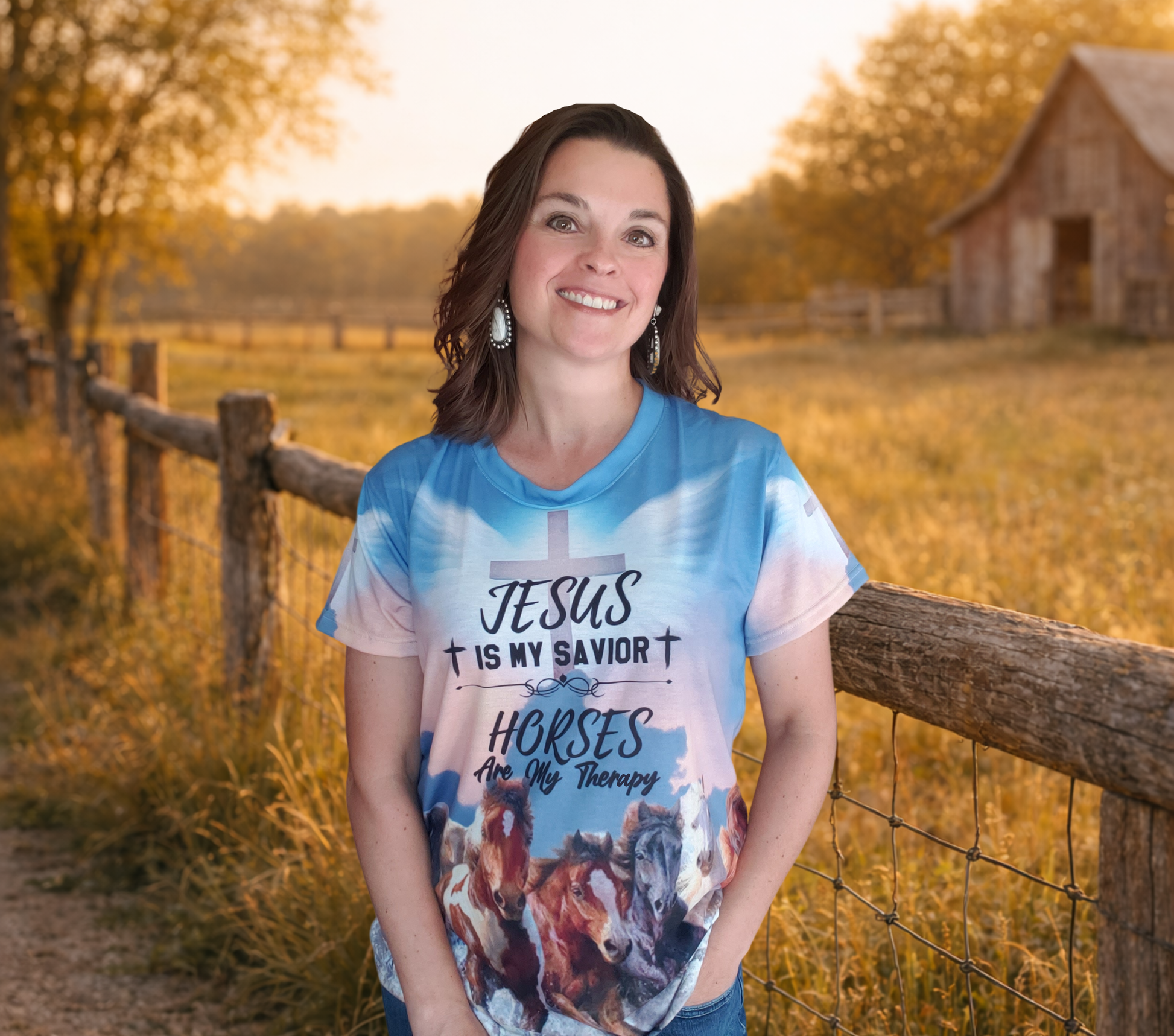 Woman wearing a t-shirt with 'Jesus is my savior, horses are my therapy' design in a rural setting.