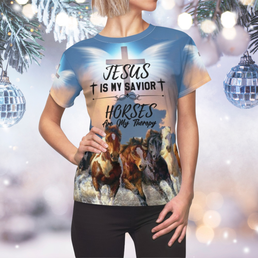 Person wearing a t-shirt with 'Jesus is my savior, horses are my therapy' design against a festive background.