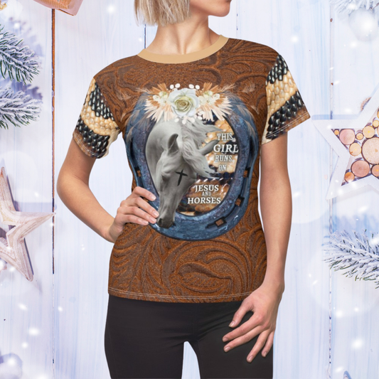 Person wearing a brown t-shirt with horse and text design against a decorative background